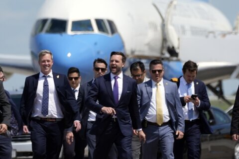 Vance jokes he's checking out his future VP plane while overlapping with Harris at Wisconsin airport