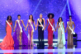 LOS ANGELES, CALIFORNIA - AUGUST 04: (L-R) Aarieanna Ware, Miss Texas USA, Macy Hudson, Miss Ohio USA, Breea Yamat, Miss Hawaii USA, Danika Christopherson, Miss Oklahoma USA, Jessi Kalambayi, Miss Colorado USA, Himanvi Panidepu, Miss Virginia USA and Melissa Sapini, Miss Massachusetts USA speaks onstage during the 73rd annual Miss USA Pageant at Peacock Theater on August 04, 2024 in Los Angeles, California.  (Photo by Alberto E. Rodriguez/Getty Images)