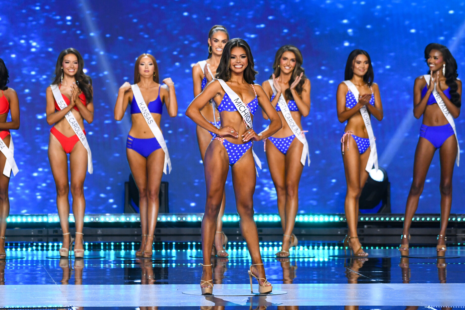 LOS ANGELES, CALIFORNIA - AUGUST 04: (L-R) Gracen Grainger, Miss South Carolina USA, Bella Whitlock, Miss Kansas USA, Christell Foote, Miss Tennessee USA, Alma Cooper, Miss Michigan USA, Kenzie Halsey, Miss North Carolina USA, Marizza Delgado, Miss New York USA and Najah Ali, Miss Nevada USA walk onstage during the 73rd annual Miss USA Pageant at Peacock Theater on August 04, 2024 in Los Angeles, California.  (Photo by Alberto E. Rodriguez/Getty Images)