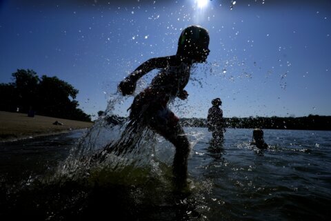 Wild week of US weather includes heat wave, tropical storm, landslide, flash flood and snow