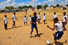 Kids in Zambia play soccer wearing donated jerseys