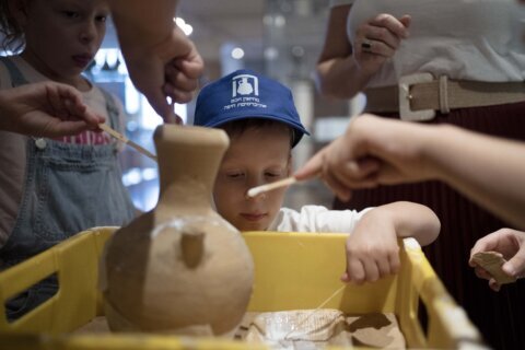 An Israeli boy who broke an ancient jar learns how the museum is piecing it back together