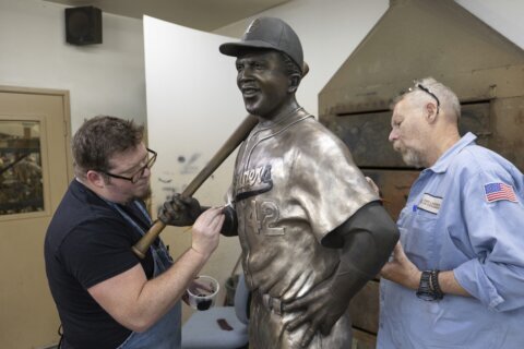A rebuilt bronze Jackie Robinson statue returns to Kansas 6 months after the original was stolen