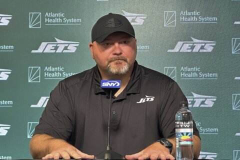 Jets GM Douglas has faith Reddick's holdout will be resolved, but team hasn't changed its stance