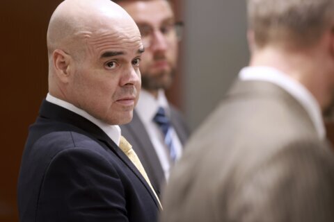 Ex-politician testifies he's innocent in the killing of a Las Vegas investigative reporter