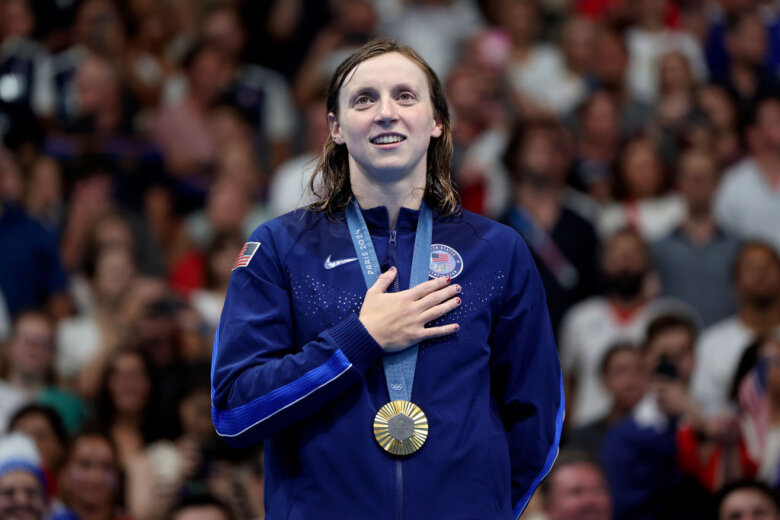 Gold Medalist Katie Ledecky of Team United States stands on the podium during the Swimming medal ceremony after the Women's 1500m Freestyle Final on day five of the Olympic Games Paris 2024 at Paris La Defense Arena on July 31, 2024 in Nanterre, France.