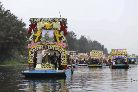 Catholic devotees honor St Jude's relic with watery procession through Mexico's Xochimilco canals