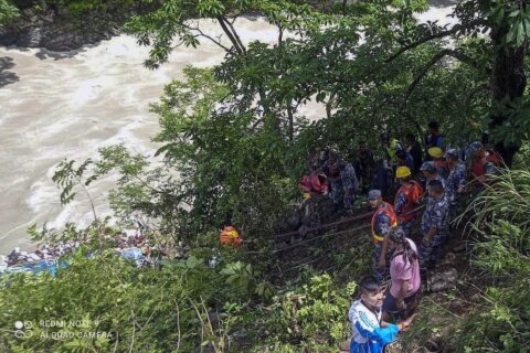 27 killed after a bus with Indian pilgrims drives off a Nepal highway and crash