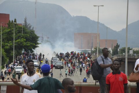 Rights group says security forces have killed 9 as Nigeria protests over hardship enter a second day