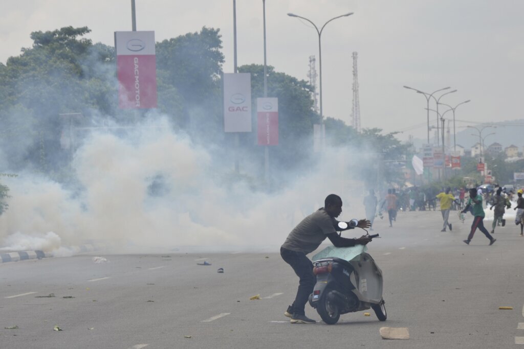 Nigerian leader calls for end to hardship protests, blaming ‘political agenda’ for violence