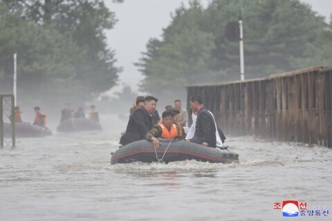 North Korean leader accuses South Korea of a smear campaign over floods and hints at rejecting aid