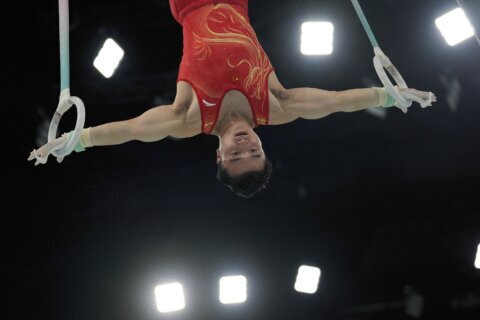 Lui Yang of China defends his Olympic gold medal in still rings