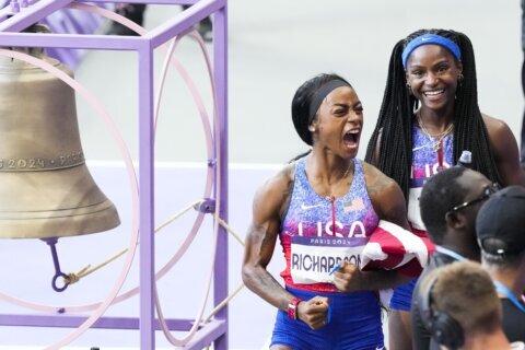 Sha’Carri Richardson chases down 2 competitors in rain to end her first Olympics with a relay gold