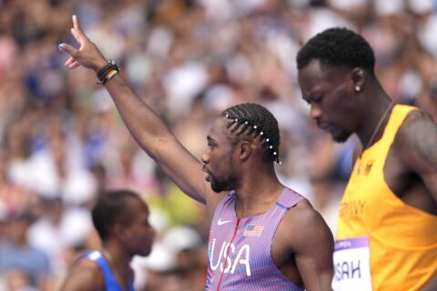 Noah Lyles closes strong to advance in 1st round of the 100 in Paris as he pursues an Olympic double