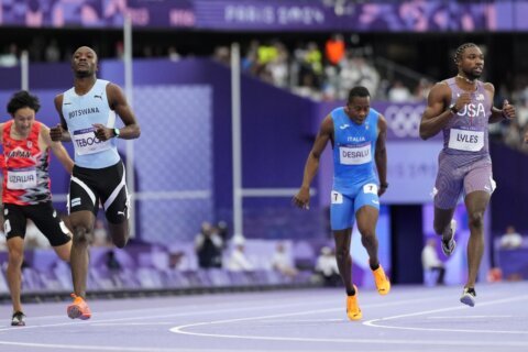 Latest US track comeback puts Quincy Hall atop the medal stand in Olympic 400 meters