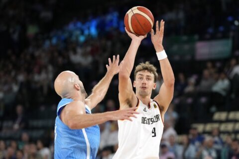 France tops Canada and Serbia beats Australia in OT to reach Olympic semis. Germany, US also advance