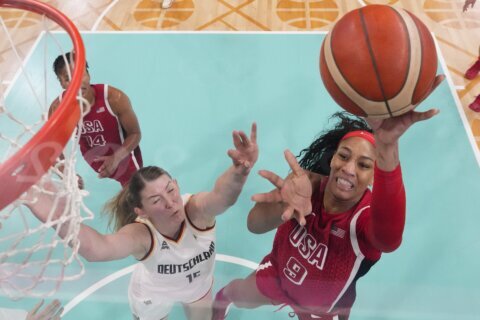 US extends Olympic win streak to 58 games with 87-68 victory over Germany; quarterfinals next