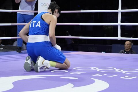 Who is Italian boxer Angela Carini and why did she quit her fight against Imane Khelif?