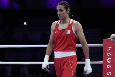 Algerian boxer Imane Khelif clinches medal at Olympics after outcry fueled by gender misconceptions