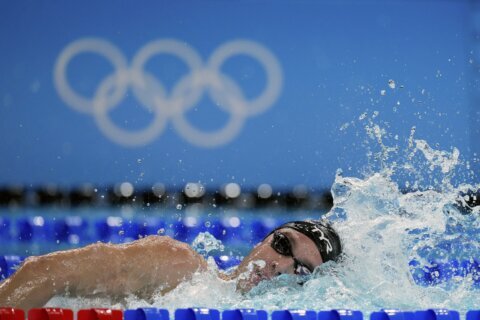 American Bobby Finke sets 1,500 freestyle world record on final night of Olympic swimming