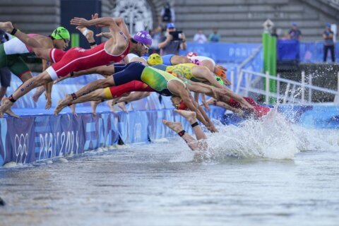 After water quality concerns canceled test runs, Olympic triathletes plunge into the Seine for relay