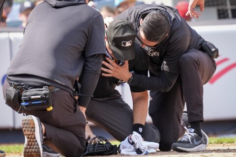 Plate umpire Nick Mahrley exits game between Rockies and Yankees after broken bat hits his neck