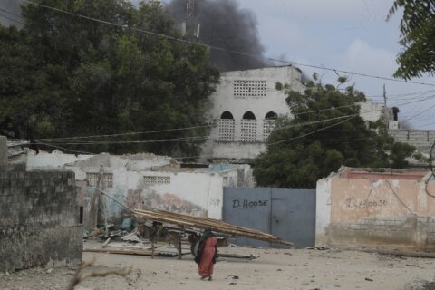 Somali police say 32 people died in an attack on a beach hotel. Al-Shabab claimed responsibility.