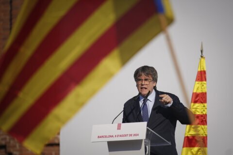 Ex-Catalan leader gives police the slip on his return to Spain after nearly 7 years as a fugitive