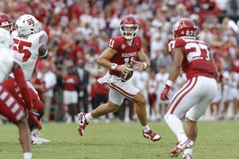 Arnold throws 4 TD passes -- 3 to newcomer Burks -- to help No. 16 Oklahoma rout Temple 51-3