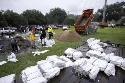 The Latest: Debby blamed for at least 4 deaths in Florida as it bears down on Georgia
