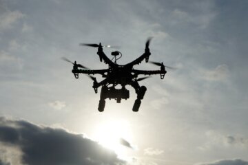 Hexacopter taking aerial photos at sunset. Also known as a drone or UAV (Unmanned Aerial Vehicle).