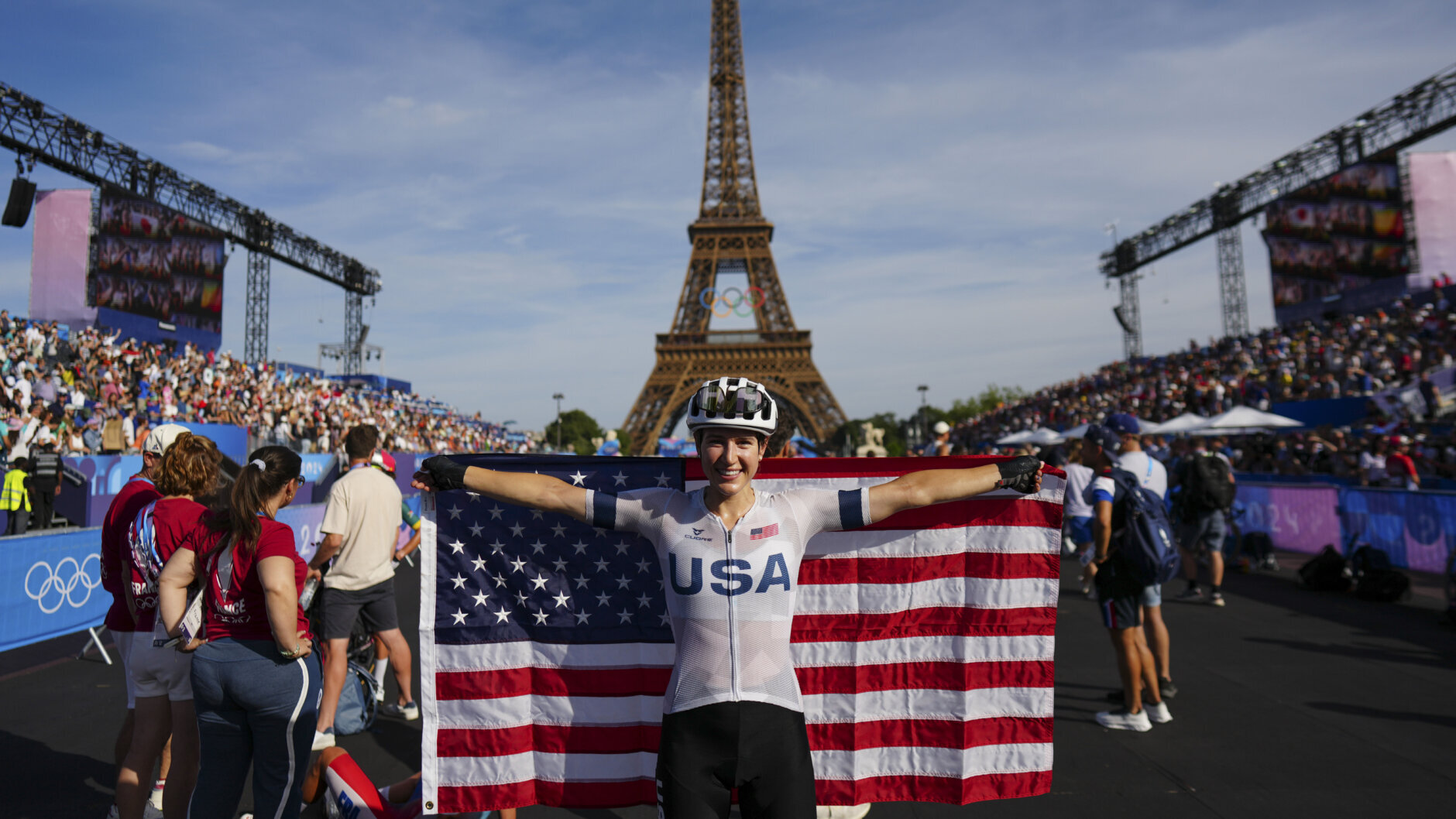 Kristen Faulkner, of the United States, celebrates winning the women's road cycling event,