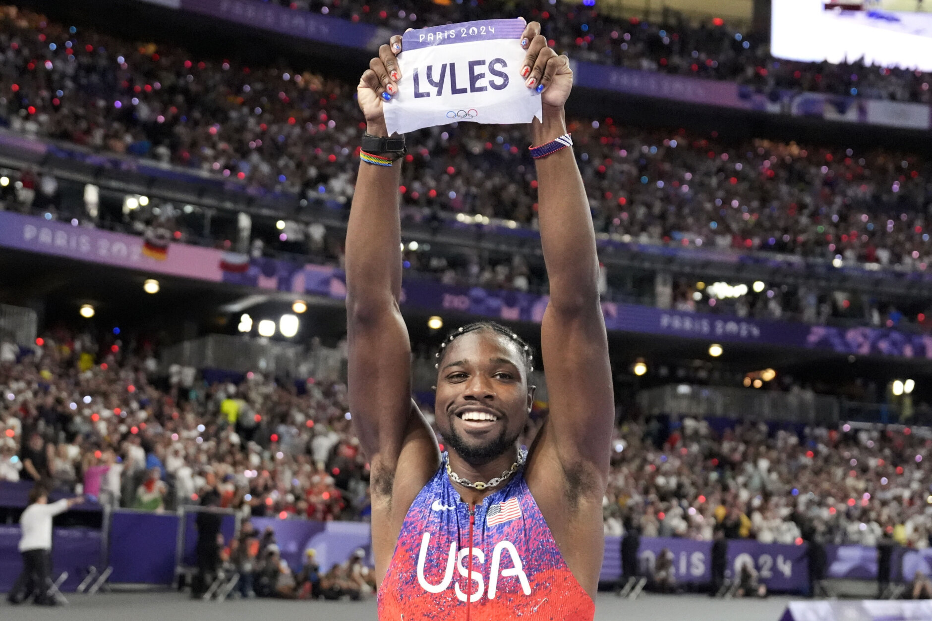 Noah Lyles, of the United States, celebrates after winning the men's 100-meters final at the 2024 Summer Olympics, Sunday, Aug. 4, 2024, in Saint-Denis, France