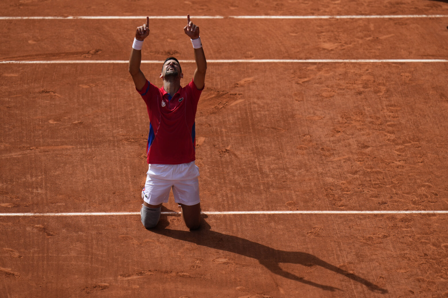 Serbia's Novak Djokovic reacts after defeating Spain's Carlos Alcaraz in the men's singles tennis final at the Roland Garros Stadium during the 2024 Summer Olympics, Sunday, Aug. 4, 2024, in Paris, France