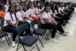 Teenage girls sitting in chairs