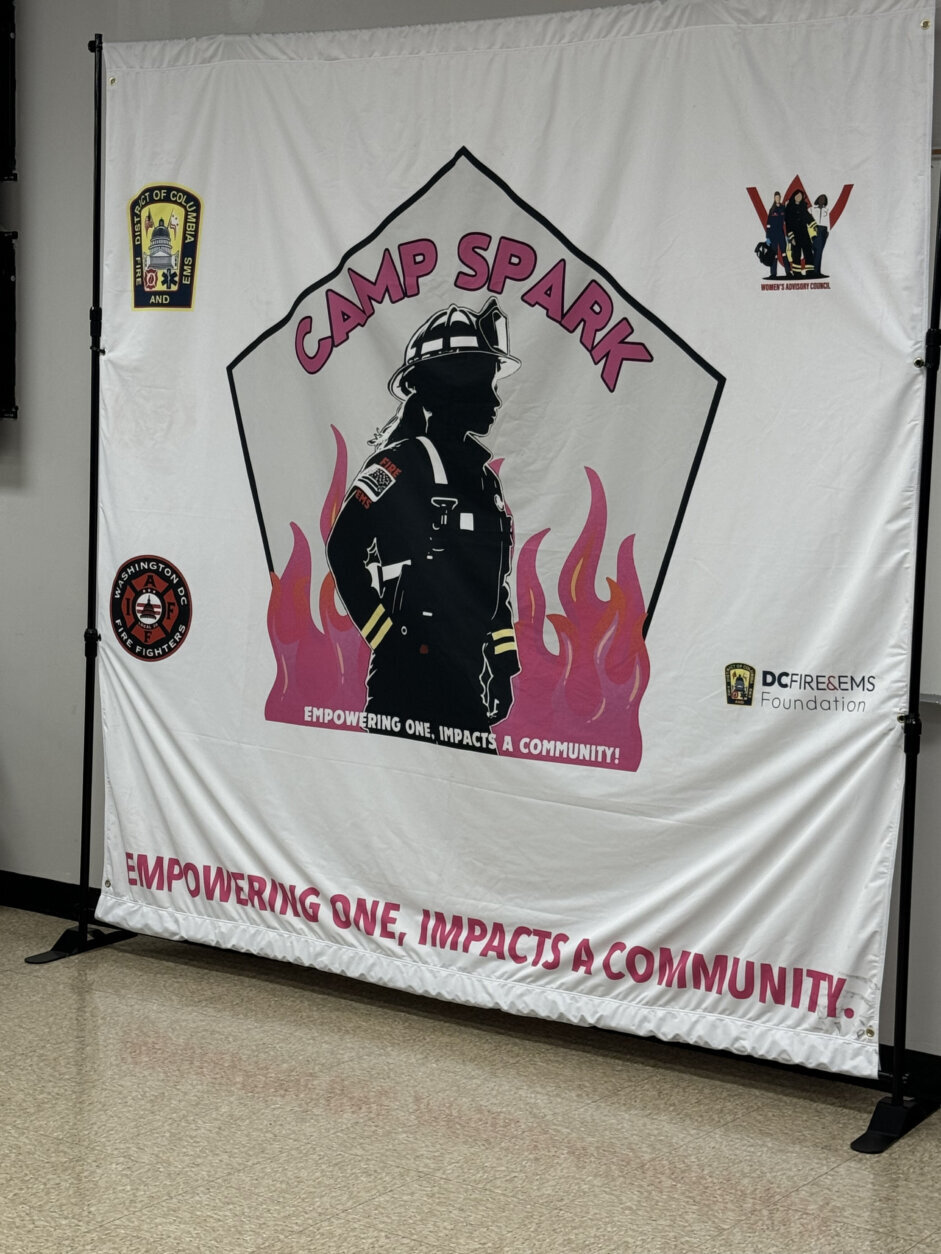 Camp Spark banner hanging on a wall