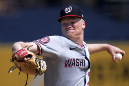 Washington Nationals starting pitcher DJ Herz delivers during the first inning of the first baseball game of a doubleheader against the Pittsburgh Pirates in Pittsburgh, Saturday, Sept. 7, 2024. (AP Photo/Gene J. Puskar)