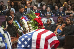 David and Wanita David, left, speak about their late father Metropolitan Police Department officer Wayne David during a funeral service at Ebenezer AME Church, Thursday, Sept. 12, 2024, in Fort Washington, Md. (Craig Hudson/The Washington Post via AP)