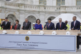 Congress members hammer in the first nails at the First Nail Ceremony marking the beginning of construction of the 2025 Presidential Inauguration platform on the steps of the Capitol, Wednesday, Sept. 18, 2024, in Washington. (AP Photo/Mariam Zuhaib)