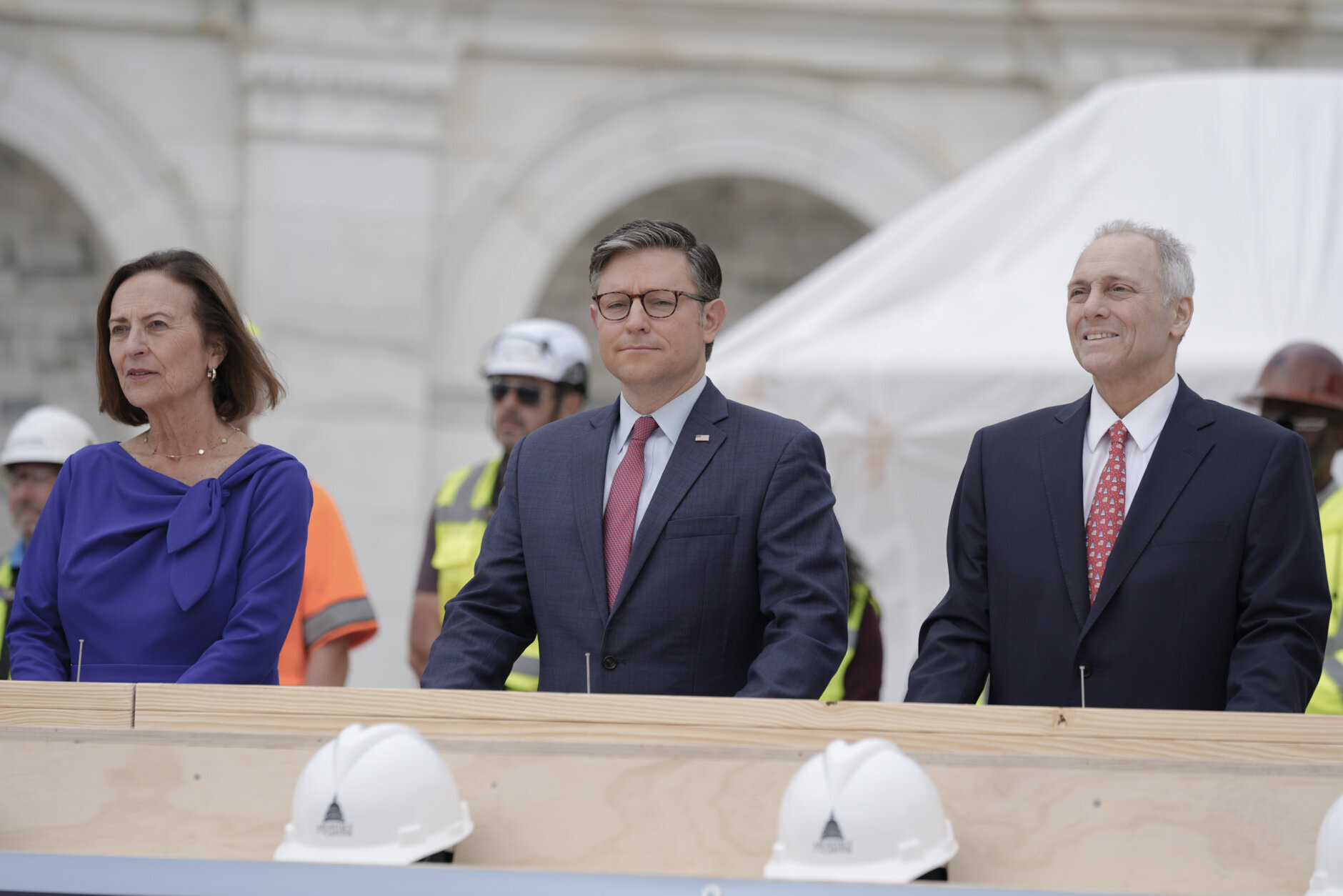 From right, House Majority Leader Steve Scalise, R-La., Speaker of the House Mike Johnson, R-La., Sen. Deb Fischer, R-Neb., attend the First Nail Ceremony marking the beginning of construction of the 2025 Presidential Inauguration platform on the steps of the Capitol, Wednesday, Sept. 18, 2024, in Washington. (AP Photo/Mariam Zuhaib)