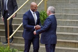 Maryland Gov. Wes Moore, left, shakes hands with King Abdullah II ibn Al Hussein of Jordan at the Maryland State House in Annapolis, Md., after participating in a roundtable discussion, Wednesday, Sept. 25, 2024. (AP Photo/Stephanie Scarbrough)