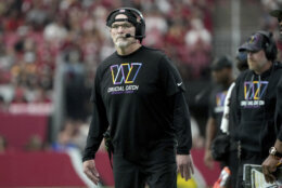 Washington Commanders head coach Dan Quinn watches play during the first half of an NFL football game against the Arizona Cardinals, Sunday, Sept. 29, 2024, in Glendale, Ariz. (AP Photo/Rick Scuteri)