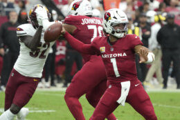 Arizona Cardinals quarterback Kyler Murray (1) throws against the Washington Commanders during the first half of an NFL football game, Sunday, Sept. 29, 2024, in Glendale, Ariz. (AP Photo/Rick Scuteri)