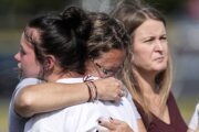 Teen charged in Georgia school shooting and his father to stay in custody after hearings