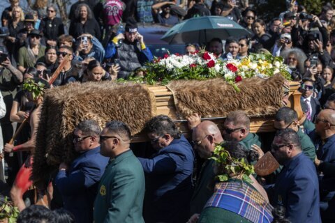 A Māori king who urged racial unity in New Zealand is laid to rest and a new queen rises