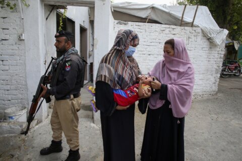 Gunmen kill a polio worker and a policeman during a vaccination campaign in Pakistan