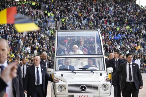 Pope wraps troubled visit to Belgium by beatifying 17th-century mystic during sunny stadium Mass