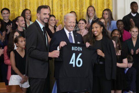 As he welcomes Gotham FC, Biden says ‘a woman can do anything a man can do,’ including be president