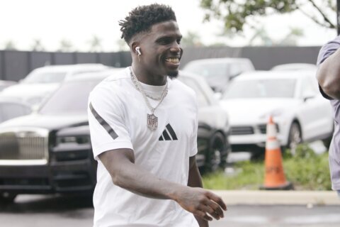 Tyreek Hill smiles and waves as he arrives at Hard Rock Stadium for Dolphins’ game against Bills