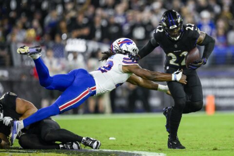 Henry runs for 199 yards and Jackson has 3 TDs as Ravens rout previously unbeaten Bills 35-10